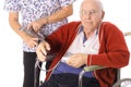 Nurse checking elderly patients blood pressure