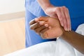 Nurse checking patients pulse Royalty Free Stock Photo