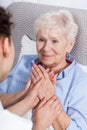 Nurse comforting elderly woman