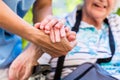 Nurse consoling senior woman holding her hand Royalty Free Stock Photo