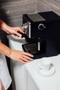 Nurse in cosmetic beauty parlour making coffee Royalty Free Stock Photo