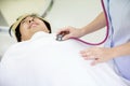 Nurse is counting heart rate. doctor using a stethoscope to listen to man patient`s chest checking heartbeat or lung in medical cl Royalty Free Stock Photo