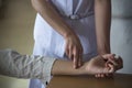 A nurse counting the patient`s pulse rate