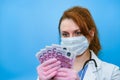 Nurse counts the bills in euros, close-up. The concept of paying doctors during the coronavirus and other diseases pandemic