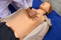 Nurse demonstrating cardiopulmonary resuscitation on a dummy human model Royalty Free Stock Photo