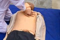 Nurse demonstrating cardiopulmonary resuscitation on a dummy human model Royalty Free Stock Photo