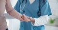 Nurse, disabled and old person holding hands for walking support, elderly care or movement disability. Closeup