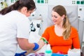 Nurse disinfecting puncture point before blood donation Royalty Free Stock Photo