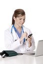 Caucasian woman Doctor or Nurse working at a desk Royalty Free Stock Photo