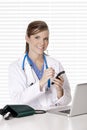 Caucasian woman Doctor or Nurse working at a desk Royalty Free Stock Photo