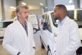 nurse and doctor having conversation in ambulance parking Royalty Free Stock Photo