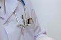 A nurse doctor medical professional holds a phonendoscope that hangs