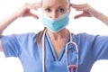 Nurse or doctor putting on PPE a medical face mask Royalty Free Stock Photo