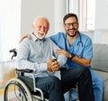 nurse doctor senior care caregiver help assistence wheelchair retirement home nursing elderly man disabled disability Royalty Free Stock Photo