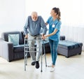 nurse doctor senior care caregiver help walker assistence retirement home nursing elderly man Royalty Free Stock Photo