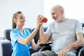 nurse doctor senior care exercise physical therapy ecercising help assistence retirement home elderly man