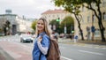 Nurse, doctor walking across city, going to work, hospital, clinic. Work-life balance of healthcare worker. Royalty Free Stock Photo