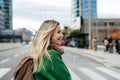 Nurse, doctor walking across city, going to work, hospital, clinic. Work-life balance of healthcare worker. Royalty Free Stock Photo