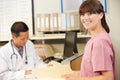 Nurse With Doctor Working At Nurses Station Royalty Free Stock Photo