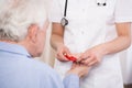 Nurse dosing drugs for patient