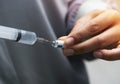 Nurse drawing medicine from a vial