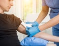 Nurse dressing wound for patient`s hand with burn injury