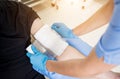 Nurse dressing wound for patient`s hand with burn injury Royalty Free Stock Photo