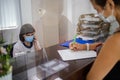 Nurse on duty speaks on the phone at the reception desk. Busy modern hospital with some of the best specialists and Medicare Royalty Free Stock Photo