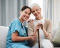 Nurse, elderly woman and sofa for portrait, walking stick and smile together with happiness, chat and care. Senior Royalty Free Stock Photo