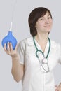 Nurse with enema is flirting Royalty Free Stock Photo