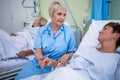 Nurse examining patients pulse Royalty Free Stock Photo