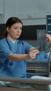 Nurse explaining xray test results to patient in hospital ward