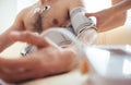 A nurse fastens the tonometer cuffs on the patient`s arm