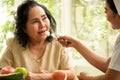 Nurse giving apple to adult female patient in the room Royalty Free Stock Photo