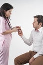 Nurse give pills to patient