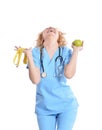 Nurse giving apple and measurement Royalty Free Stock Photo