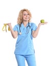 Nurse giving apple and measurement Royalty Free Stock Photo