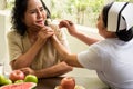 Nurse giving apple to senior female patient in the room Royalty Free Stock Photo