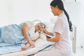 Nurse giving consoling to senior and encourage in the hospital. Royalty Free Stock Photo