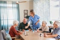 Nurse giving daily medicine to seniors at nursing home Royalty Free Stock Photo