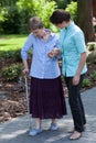Nurse goes for a walk with the old lady Royalty Free Stock Photo