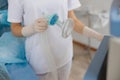 Nurse hands holding breathing mask in operating room before operation Royalty Free Stock Photo