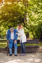 Nurse helping elderly disabled man Royalty Free Stock Photo