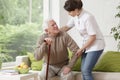 Nurse helping elderly man