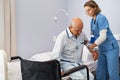 Nurse helping senior patient at clinic Royalty Free Stock Photo