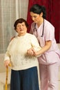 Nurse helping sick senior home Royalty Free Stock Photo