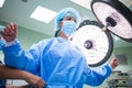 Nurse helping a surgeon in wearing scrub Royalty Free Stock Photo