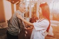 Nurse Helps Adult Walker. Pensioner on Go-Carts Royalty Free Stock Photo