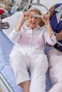 Nurse helps a patient to get up in hospital :nurse helping senior woman get up with credence