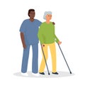 A nurse helps a woman with crutches to walk. An elderly disabled patient and a caregiver.